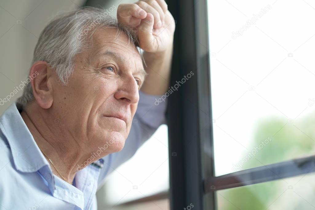 man looking by window