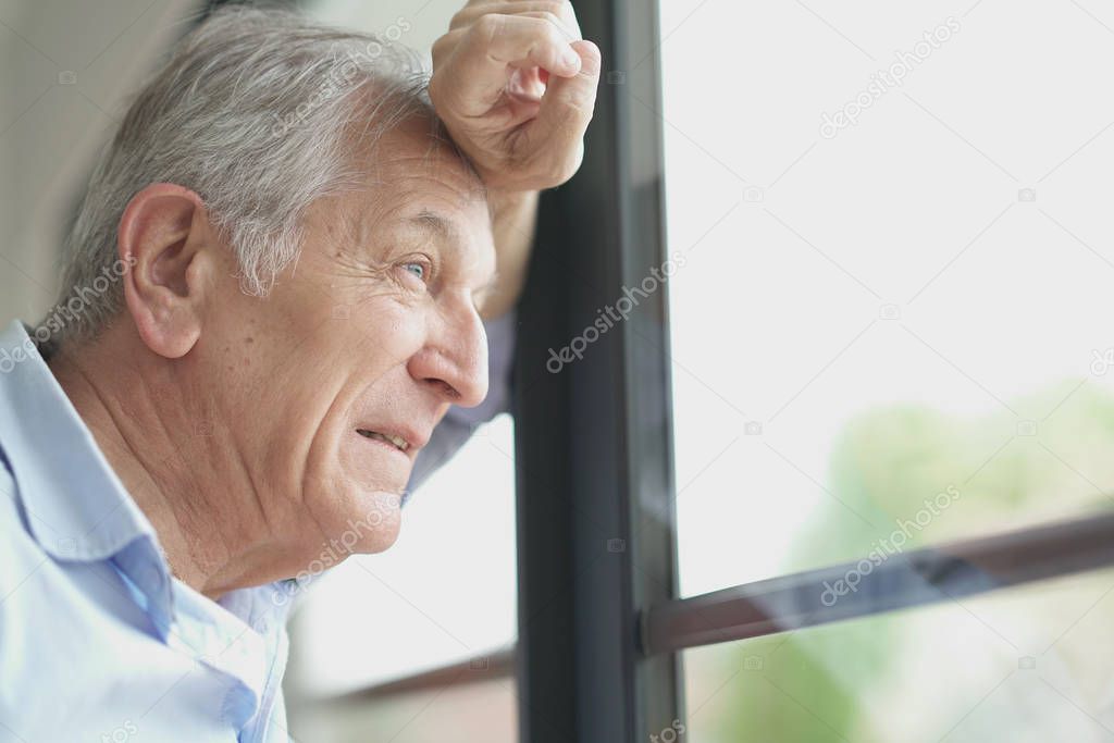  man looking by window