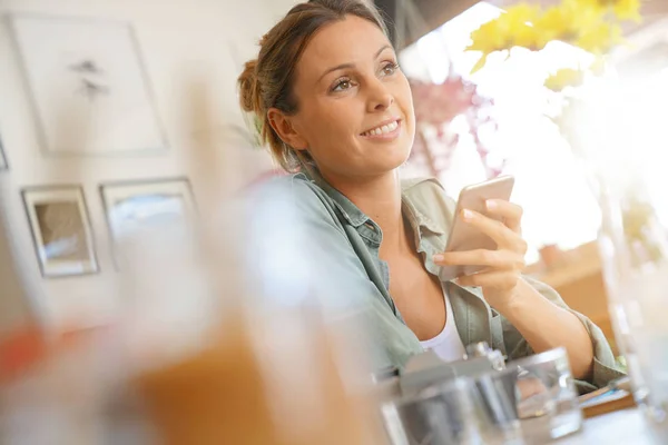 Trendy girl using smartphone — Stock Photo, Image