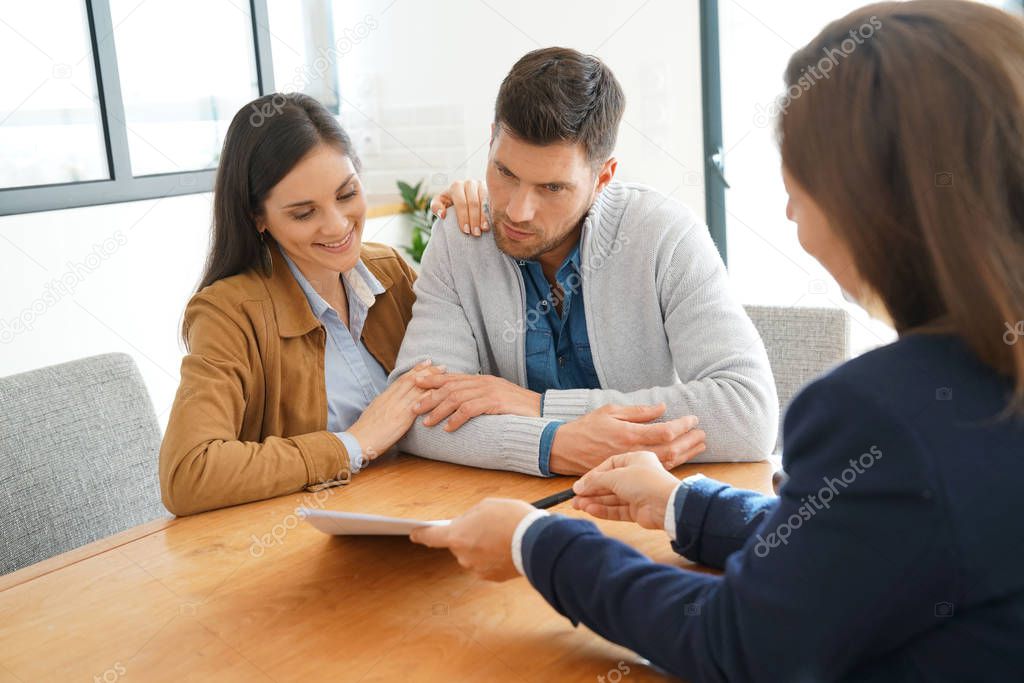Couple meeting financial adviser 