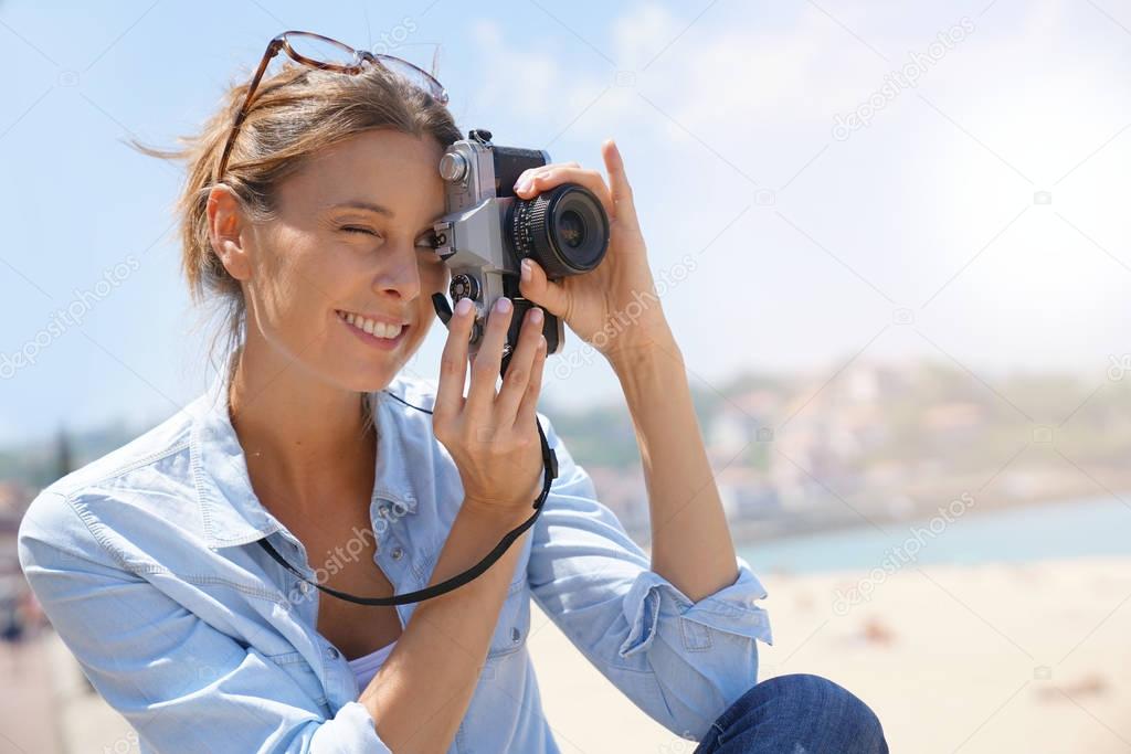 Cheerful girl taking pictures 