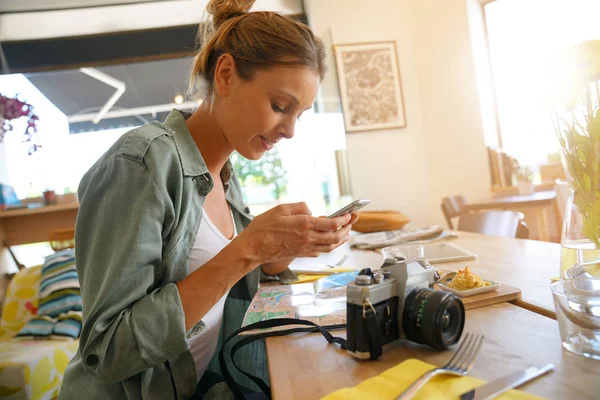 Trendy girl using smartphone — Stock Photo, Image