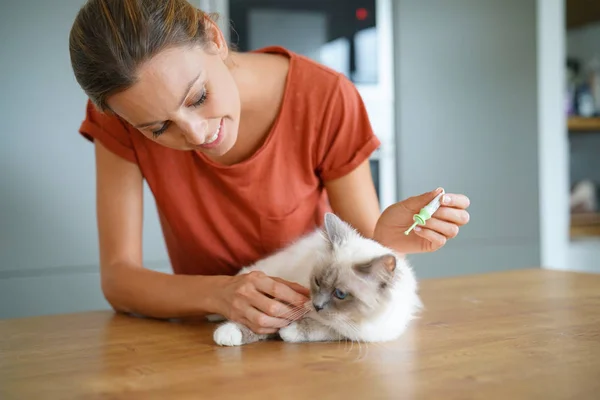 Woman injecting cat