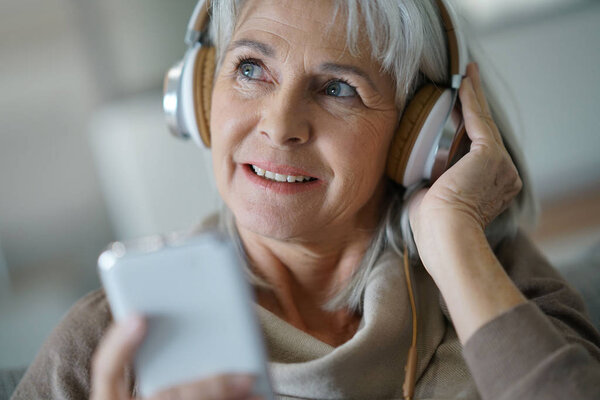 woman at home listening to music 