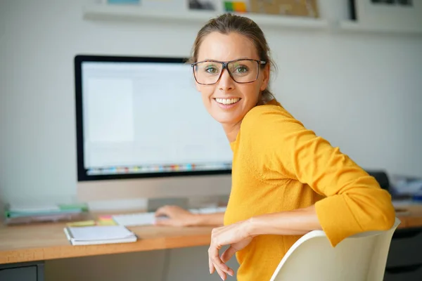 girl working on desktop computer