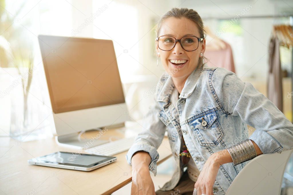 designer sitting in front of desktop