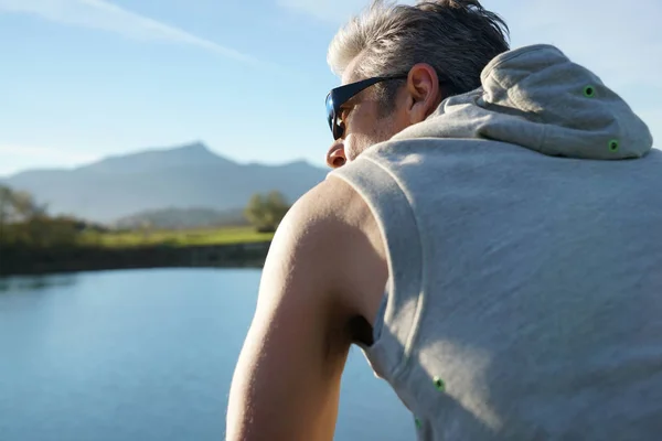 Mature man exercising outside — Stock Photo, Image