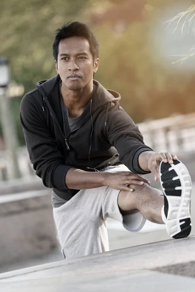 Asian guy stretching out — Stock Photo, Image