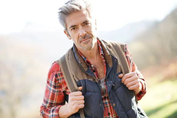 Hiker  walking in the mountains — Stock Photo, Image