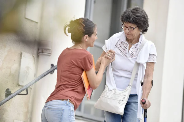 Home carer helping disabled woman — Stock Photo, Image