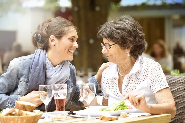 Woman with home carer having lunch — Stock Photo, Image