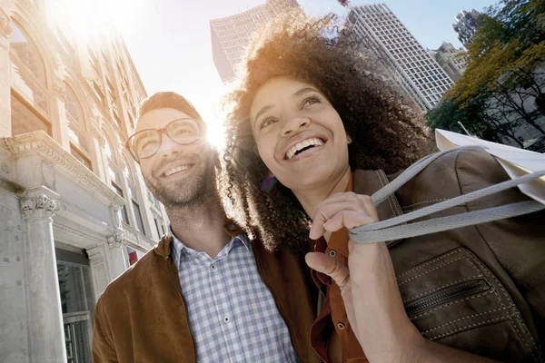 Cheerful couple doing shopping — Stock Photo, Image