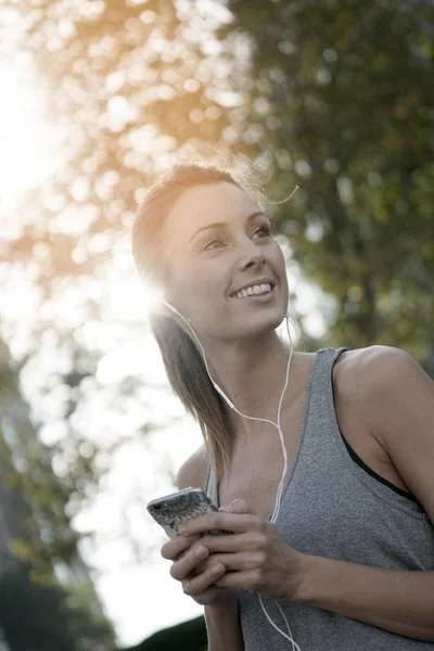 Cheerful girl in jogging — Stock Photo, Image