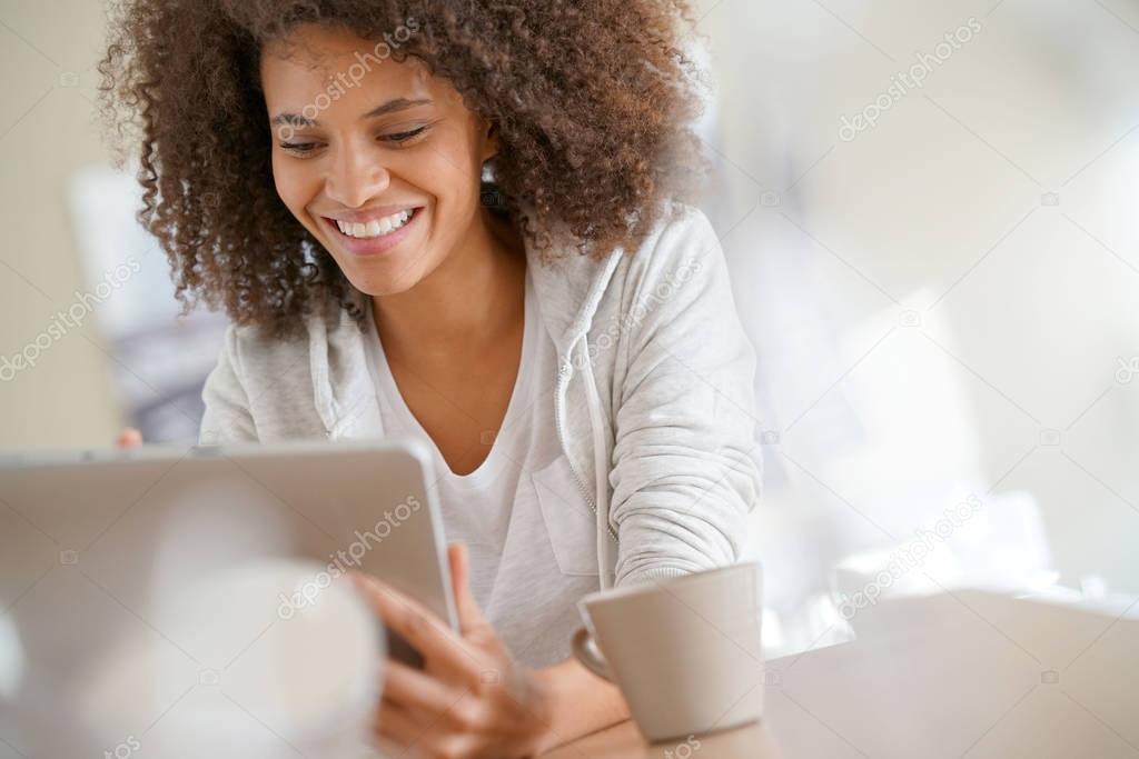 woman at home using tablet 