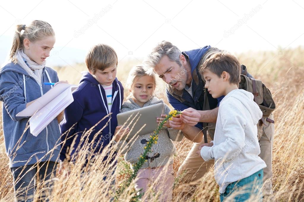 Teacher taking kids to countryside 