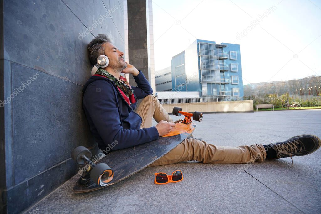 Skateboarder  listening to music