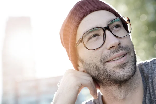 R guy with eyeglasses and cap relaxing — Stock Photo, Image