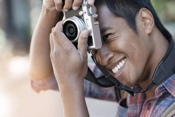 Young man taking picture