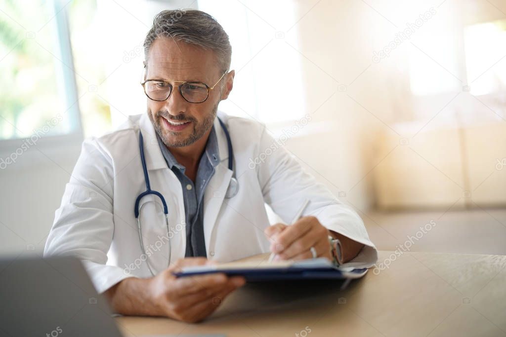  doctor sitting in medical office
