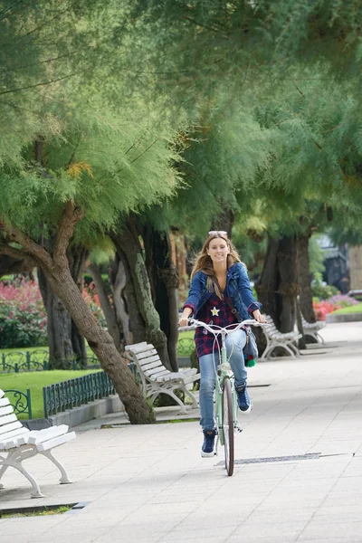 Girl riding city bike — Stock Photo, Image