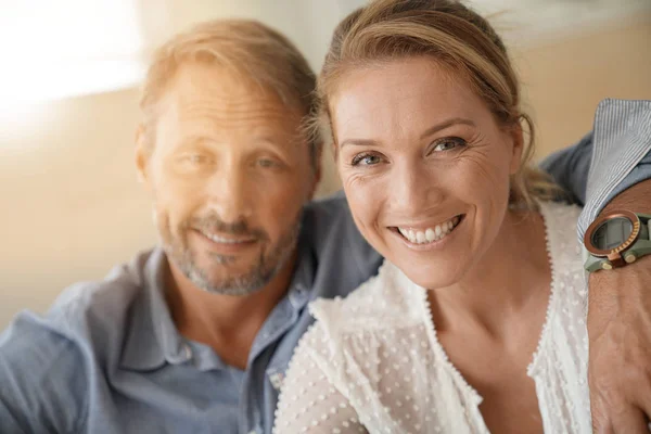 Mature couple relaxing at home