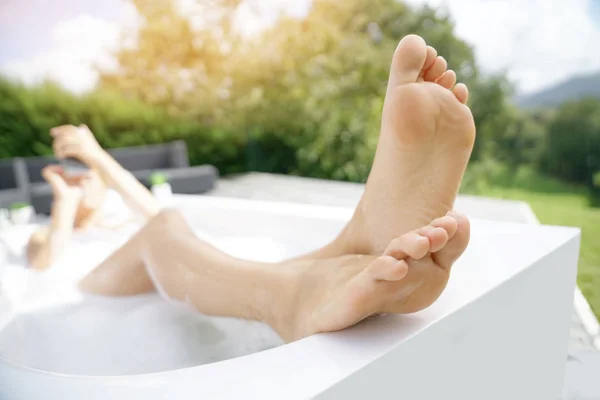 Woman's legs in bathtub — Stock Photo, Image