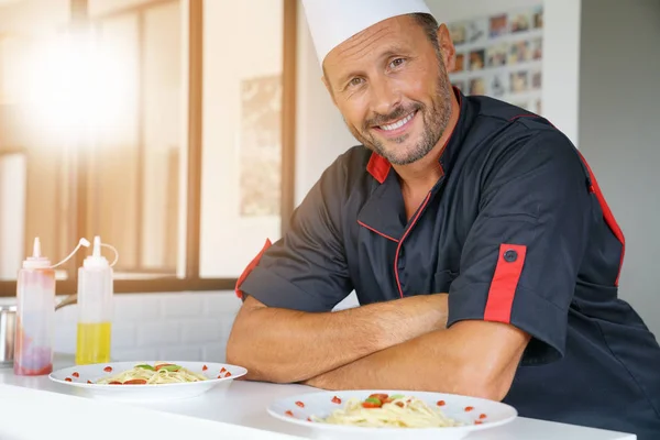 Portrait of chef in uniform standing — Stock Photo, Image