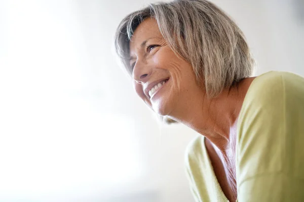 Woman at home relaxing in armchair — Stock Photo, Image