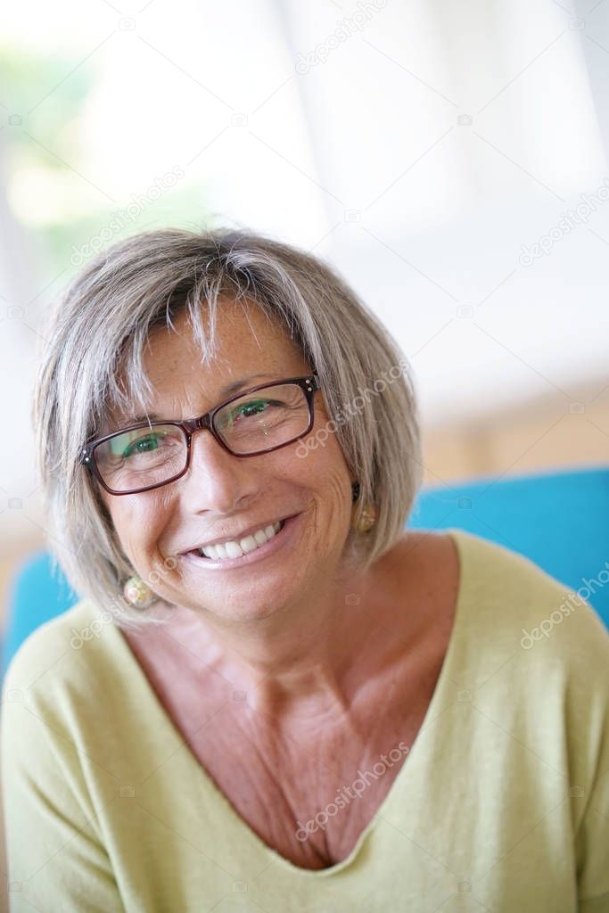 senior woman with eyeglasses on 