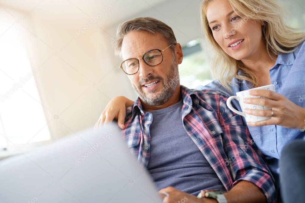 Mature couple connected on internet 