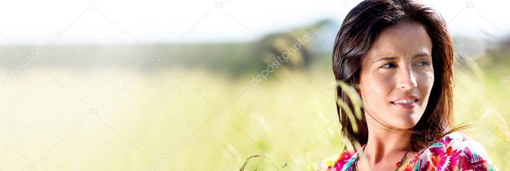 Beautiful young woman in nature landscape - banner template web 