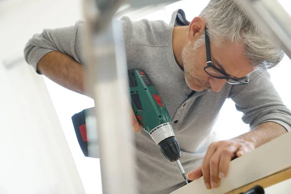 Man Assembling Diy Furniture Using Electric Drill — Stock Photo, Image