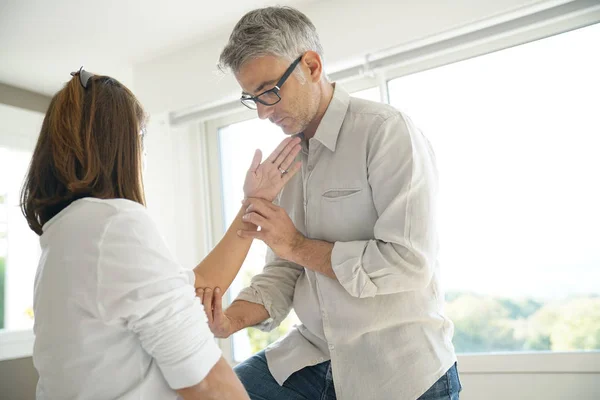Physiotherapist Stretching Patient Arm — Stock Photo, Image