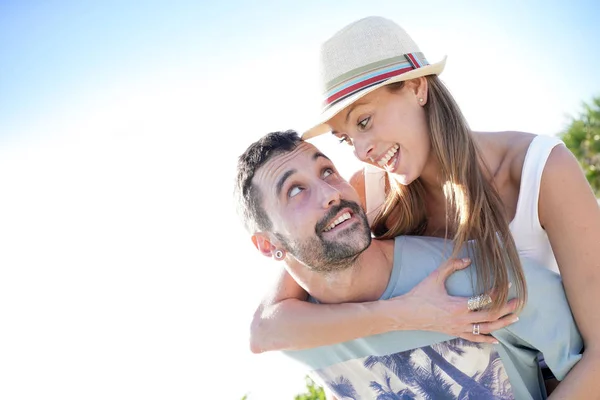 Cheerful Love Couple Piggyback — Stock Photo, Image