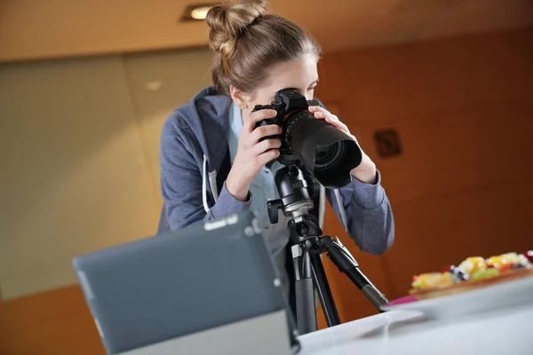 Young woman on photography training class