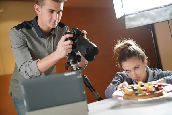 Young people in photography training course