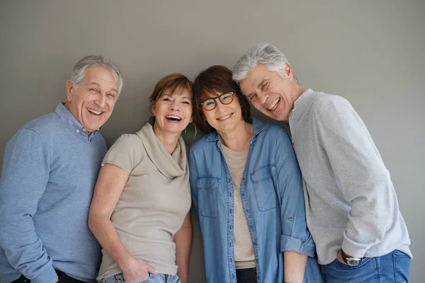 Group of senior people, isolated on grey background