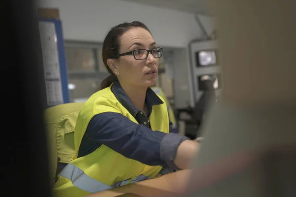 Industrial technician working in monitoring control room