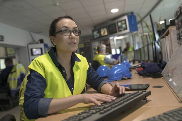 Industrial technician working in monitoring control room