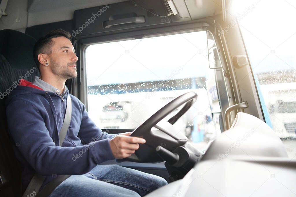 Truck driver at streering wheel