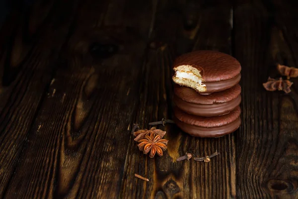 Three Choco pie sweet dessert on the village dark old table