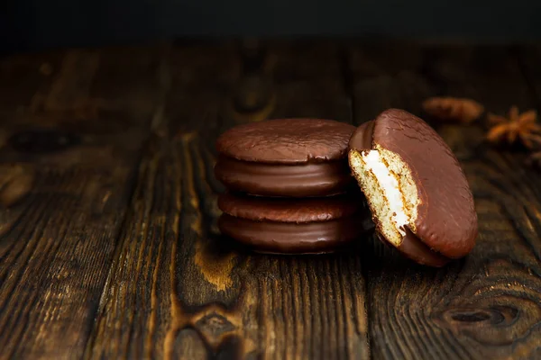 Three Choco pie sweet dessert on the village dark old table