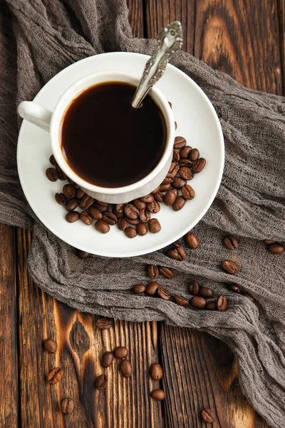 A block from delicious dark chocolate bar pieces on a wooden dark old table — Stock Photo, Image