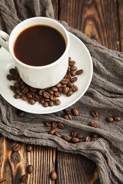 A block from delicious dark chocolate bar pieces on a wooden dark old table — Stock Photo, Image