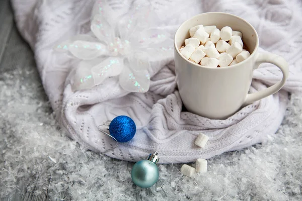 Cup of cacao with marshmallow on Christmas wooden background