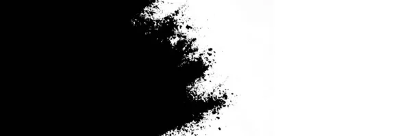 Design of a splash of black dry paint on a white background