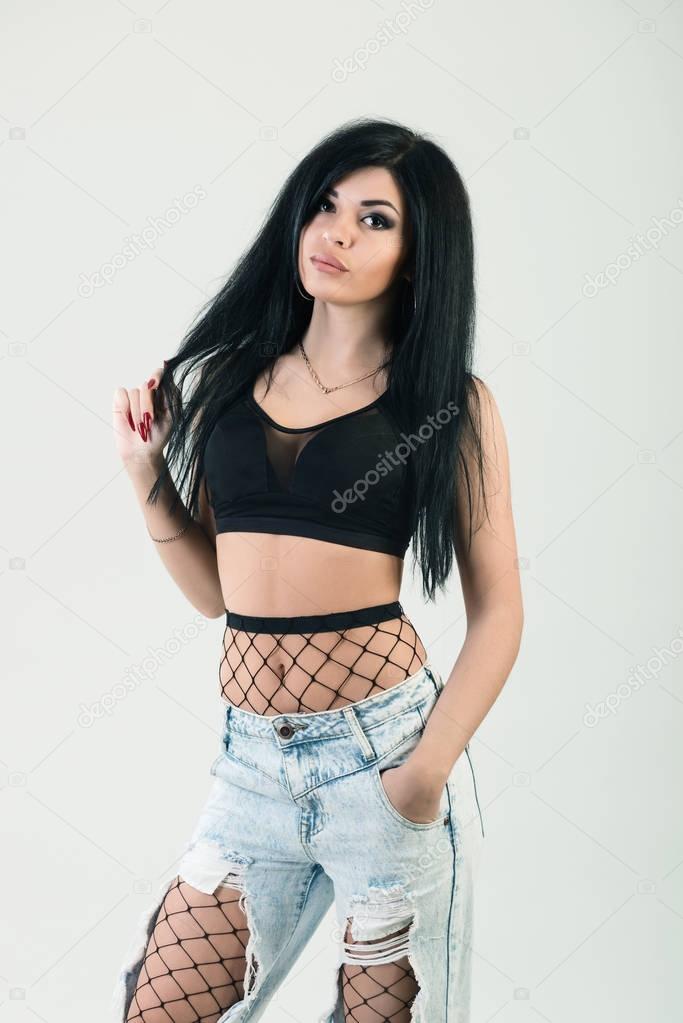 Close-up fashion portrait of young stylish hipster girl posing, 
