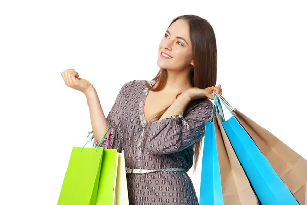 Mujer hermosa feliz con bolsas aisladas en blanco . — Foto de Stock