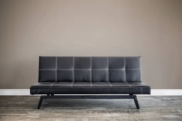 Front view of black leather sofa. — Stock Photo, Image