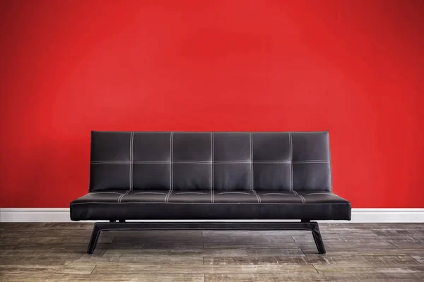 Front view of black leather sofa. — Stock Photo, Image